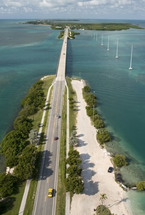 Along the Overseas Highway, the Atlantic Ocean lies on one side of the road, with Florida Bay and the Gulf of Mexico on the other, providing drivers breathtaking vistas of open water and sky. Photo: Andy Newman/Florida Keys News Bureau
